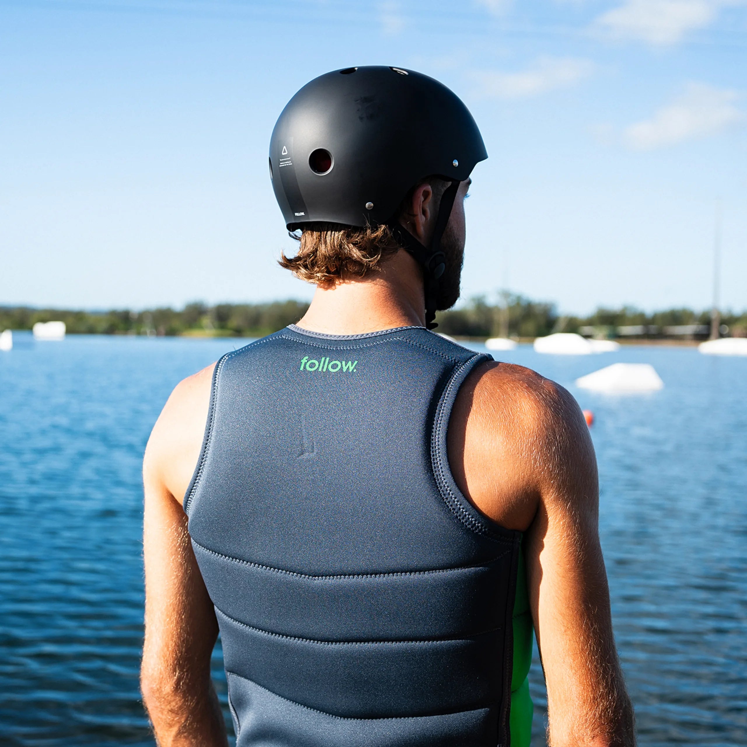 Follow Corp Men's Life Jacket - Black/Green in use