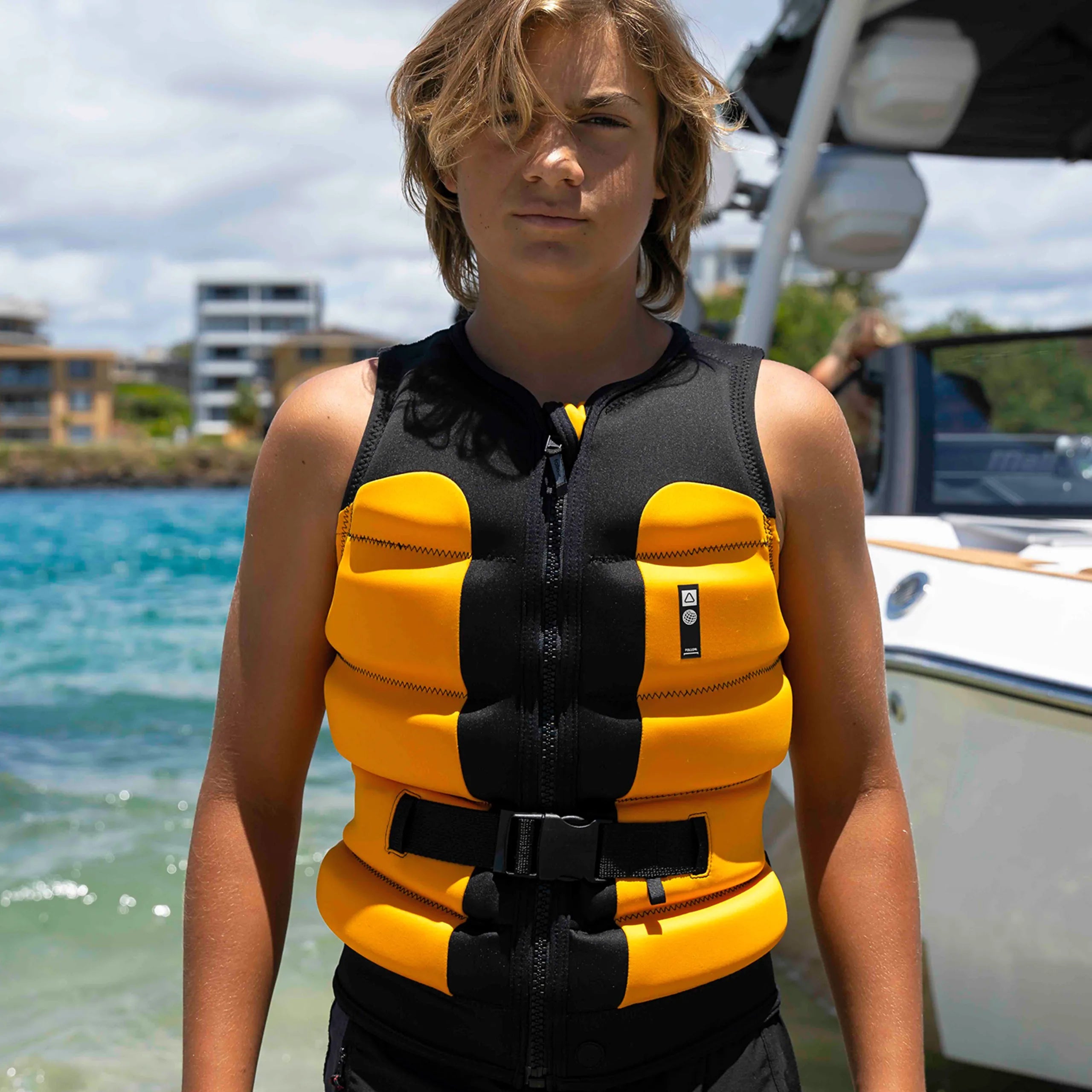 Follow Global Youth Life Jacket - Black/Orange in use
