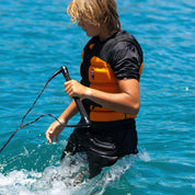 Follow Global Youth Life Jacket - Black/Orange in use