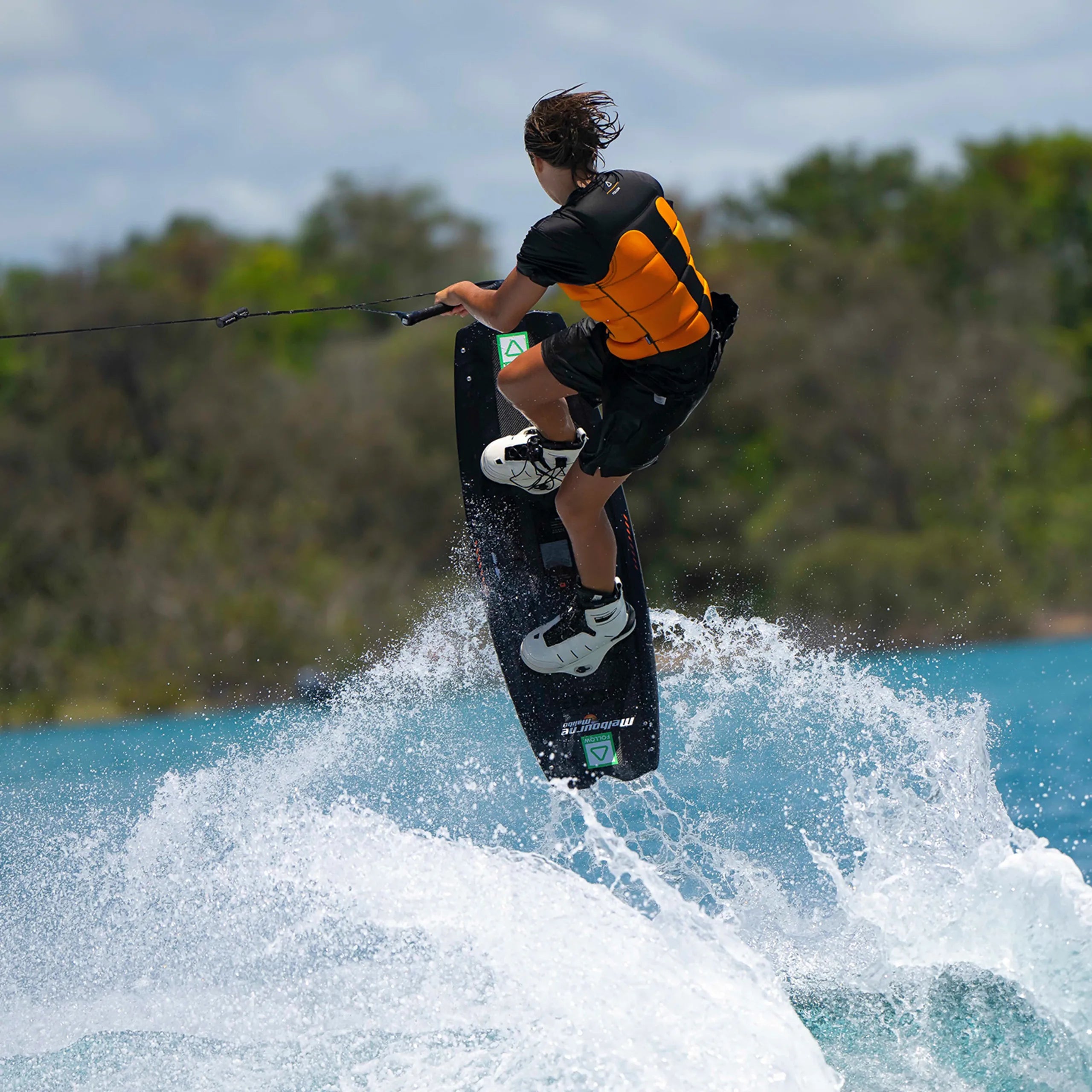 Follow Global Youth Life Jacket - Black/Orange in use