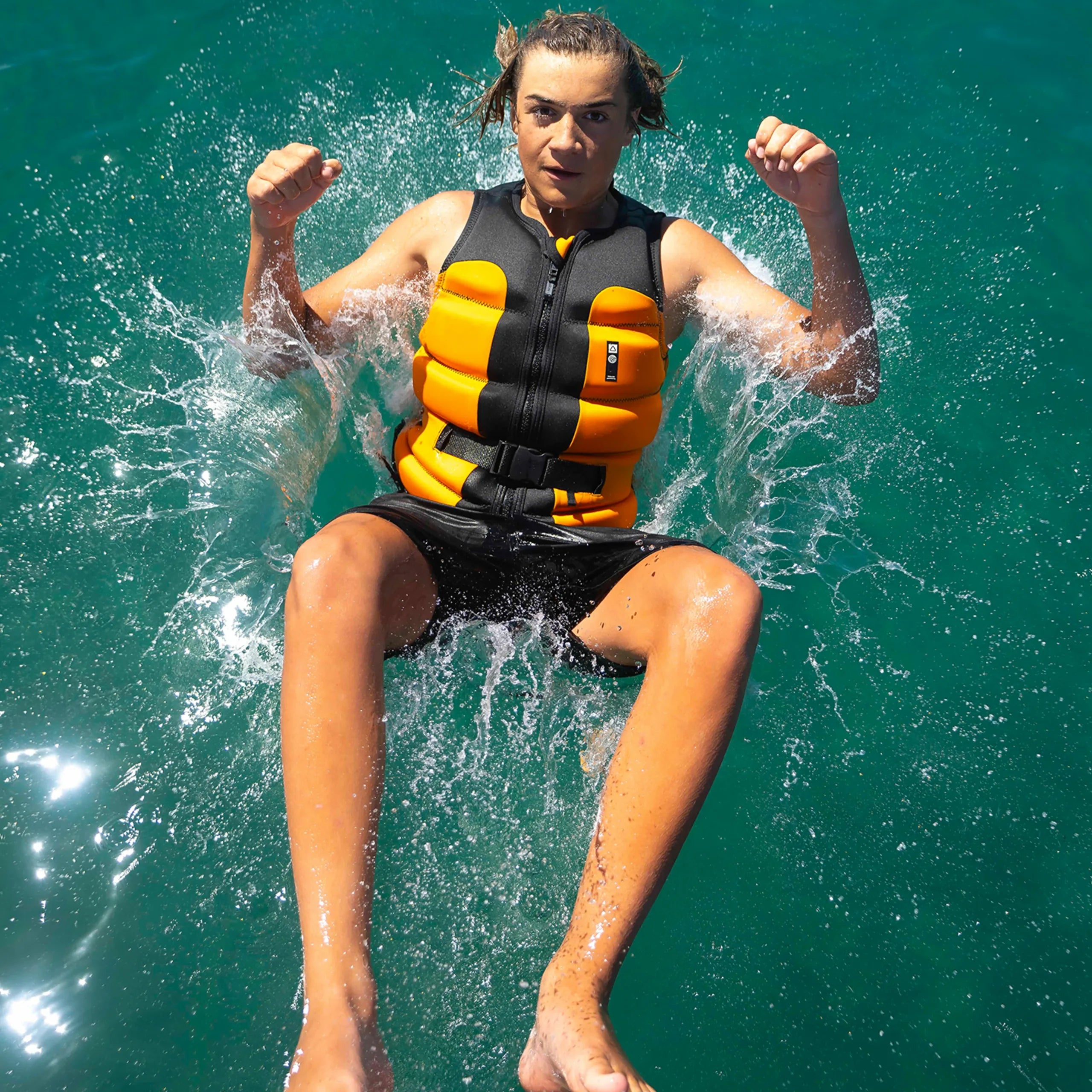 Follow Global Youth Life Jacket - Black/Orange in use